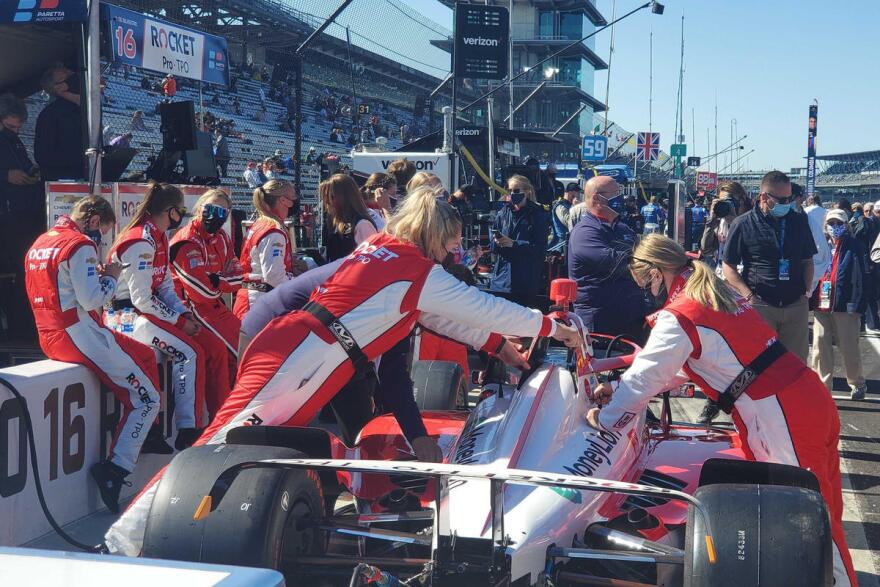 Paretta Autosport crew members prepare the car ahead of the 105th running of the Indianapolis 500.