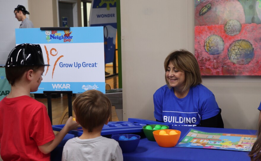 Two kids playing an activity game with PNC Grow Up Great®