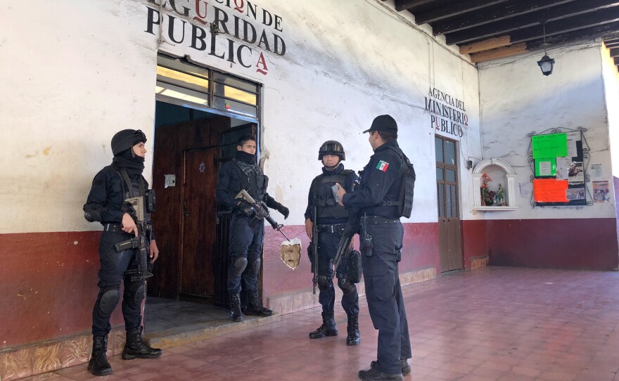 Police officers of Tancitaro's 80-member force gather before going out on patrol.