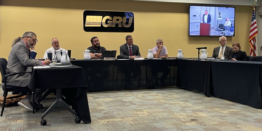 GRU Authority board members listen during the general public comment portion of the meeting on Wednesday, Oct 14, 2026. (Rachel Hunter/WUFT News)