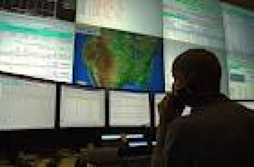 ERCOT employees monitoring the power grid.