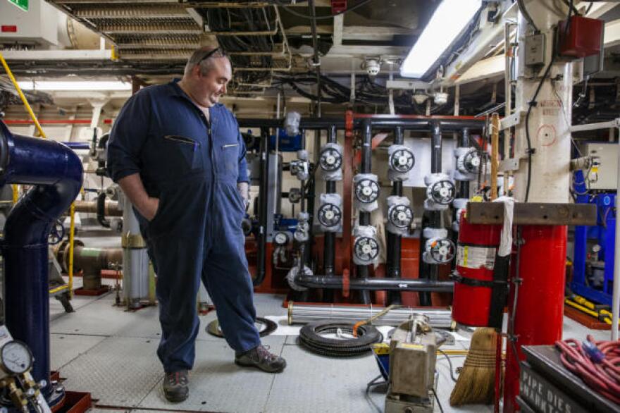First engineer Tom Robinson, of Wrangell, looks around the engine room of the Matanuska on Friday, February 7, 2020 at the Auke Bay ferry terminal in Juneau, Alaska. The ship’s breakdown has left most of Southeast Alaska without ferry service. (Photo by Rashah McChesney/KTOO)