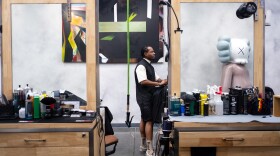 Quincy Chery, who owns and operates the Cutting Gallery in Miramar. The barbershop doubles as an art gallery for up and coming artists.