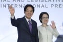 Taiwan Vice President and Democratic Progressive Party presidential candidate William Lai, left, and his running mate Hsiao Bi-khim wave to the press during an international press conference in Taipei, Taiwan, Tuesday, Jan. 9, 2024. Taiwan will hold its presidential election on Jan. 13. (AP Photo/Chiang Ying-ying)