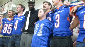 Dorial Green-Beckham, wearing a Mizzou hat, celebrates with teammates at Hillcrest High School after announcing his decision to