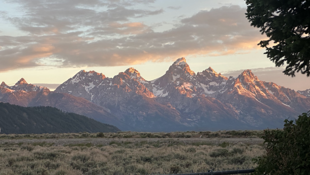 Mountains rise behind the plains.