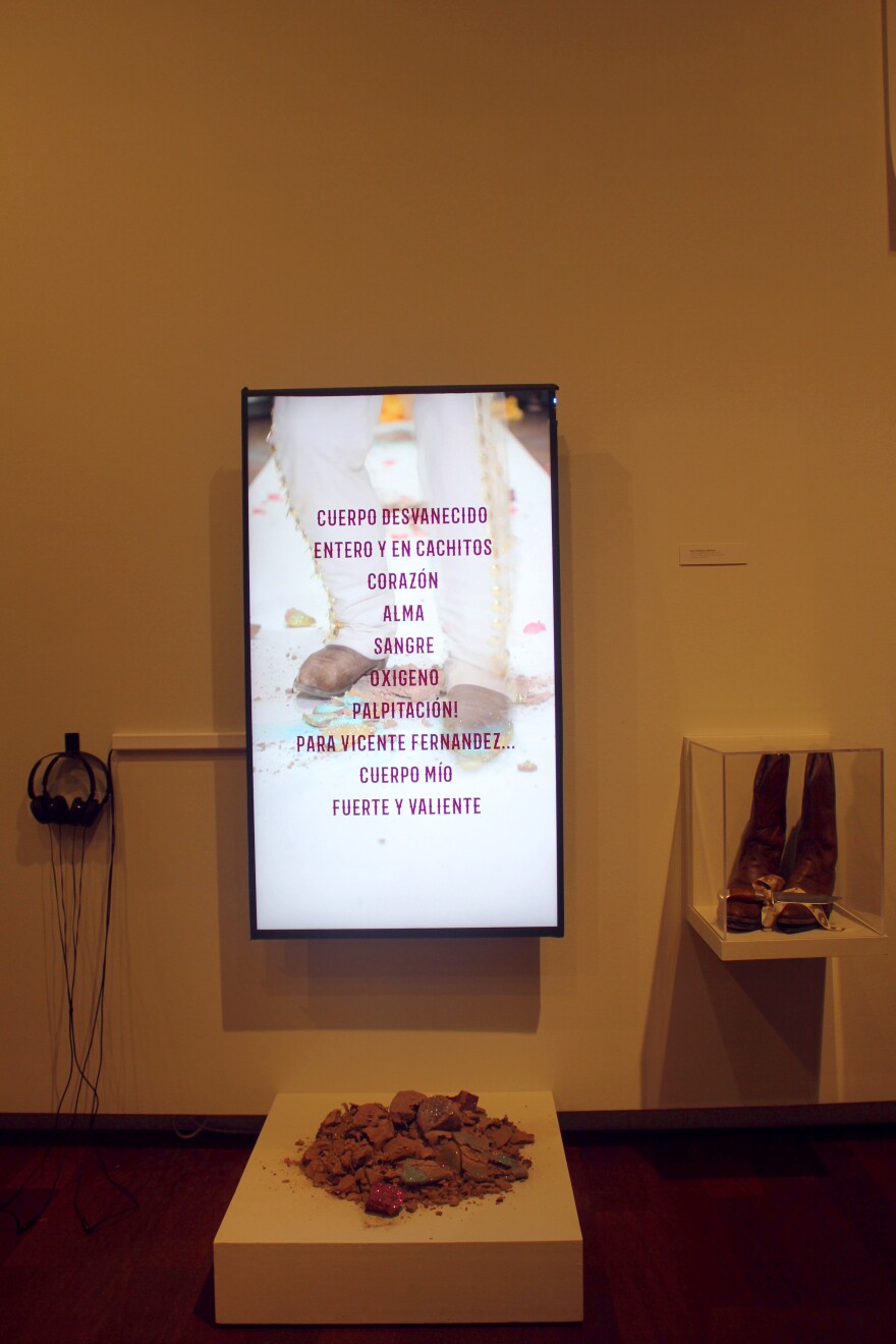 Part of Jose Villalobos' "Fragile Soles" exhibit is a poem written in Spanish.
