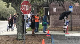 Early voters wait in line on Oct. 19, 2020 at the Regency Branch of the Jacksonville Public Library.
