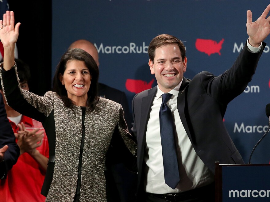 Republican presidential candidate Marco Rubio (R) and South Carolina Gov. Nikki Haley (L) celebrate after Rubio addressed supporters at a primary night event February 20 in Columbia, South Carolina.