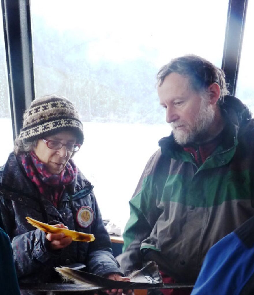 Humpback researcher Jan Straley shows whale baleen to a passenger during a Nov. 3 whale-watching tour in Sitka Sound. Photo by Ed Schoenfeld.