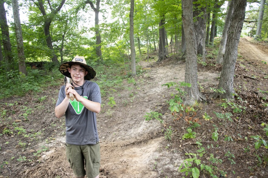 Willis Sparks pauses for a photo while working on the Campus Flow Trail in early June. Sparks got his start at a TrailHeads Southwest Indiana mountain biking club at his school.