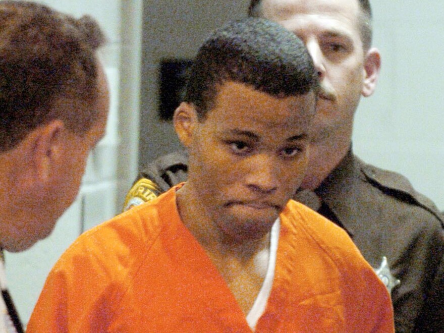 In a 2004 photo, convicted sniper Lee Boyd Malvo enters a courtroom in the Spotsylvania Circuit Court in Spotsylvania, Va. Maryland's highest court ruled on Friday that Malvo must be resentenced because of U.S. Supreme Court decisions relating to constitutional protections for juveniles made after Malvo was sentenced to six life sentences without the possibility of parole.