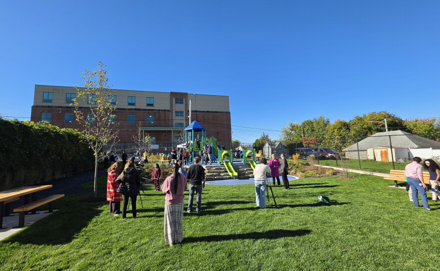 School and community leaders view the transformed schoolyard at Whittier on Tuesday.