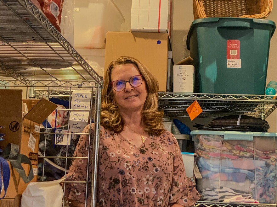 Jo Jones, founder and CEO of Jacob's Hope, standing inside of one of the organization's storage areas.