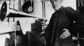 <b>Thomas Alva Edison: </b> Transformed American industry and culture by inventing the phonograph and the motion picture camera and developing a long-lasting electric light bulb. Known as the Wizard of Menlo Park, Edison also founded General Electric. In this photo from 1877, Edison stands with the phonograph. 