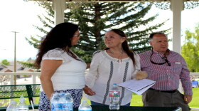 Cheryl Eagle (L) with Indian People's Action, and Geoff Gallus (R) with the Butte Area Rising Coalition, comfort Miki Chessmore (M), who's house was spray painted with racial slurs in early June. June 15, 2019.