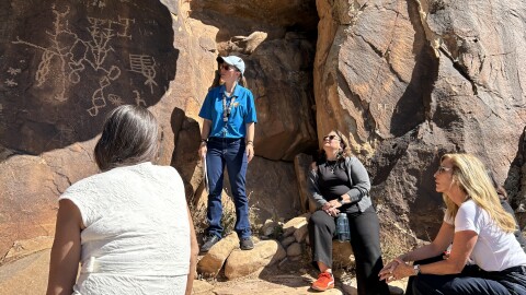 People on a tour of petroglyphs at Dominguez Canyon Wilderness of Colorado