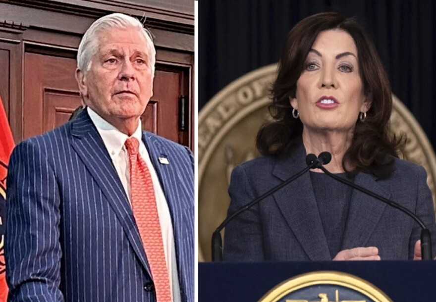 The left side is a photo of Bruce Blakeman in a suit, and the right side is a photo of Kathy Hochul at a lectern. Both photos are pretty closely cropped, so there's not much else going on here to be honest. 