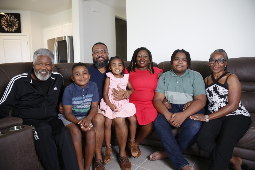  Nathan Williams II, and his wife, Kiva Williams, and their children – Noah, Nia and Nathan III – pose for a portrait in their Tampa home on July 9. With them are Kiva’s parents,  Willie and Vivian Connor.