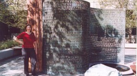 Elonka Dunin stands next to Kryptos in 2002, when she was allowed access to CIA's headquarters in Langley. (Courtesy of Elonka Dunin)