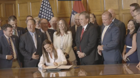 Gov. Sarah Huckabee Sanders signs five pieces of legislation into law.