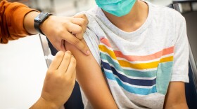 A student receives a COVID-19 vaccination as part of a Del Valle Independent School District vaccine distribution on Nov. 12.
