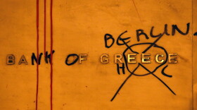 Protesters have "renamed" the Bank of Greece in honor of Germany, which many Greeks see as having undue influence over economic decisions in their country. The sign is seen in Syntagma Square on Feb. 12, 2012 in Athens, Greece.