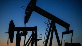 Oil pump jacks operate at dusk in Long Beach, Calif., on April 21, 2020. After getting burned by the oil industry's previous boom-and-bust cycles, Wall Street now wants energy companies to pump less crude, not more.