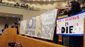 A group of students with UNC Charlotte's NAACP chapter urged the city council Monday to take action on police killings of black men. 