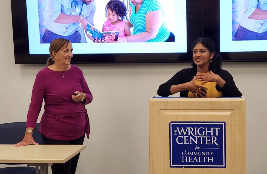 Sandie Lamanna, left, chair of the Lackawanna County Literacy Committee, discusses reading with Wright Center physician Dr. Manju Thomas.