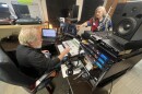 Walter and Willa Volz prepare the first broadcast on Community Radio St. Louis from the station's new location in Lindenwood Park Place this month.
