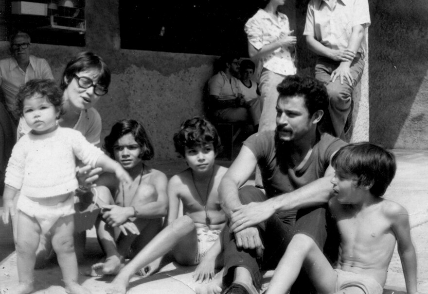 Maria Amelia Teles (left) sits with her husband Cesar Teles and their two children in Sao Paulo in the 1970s. She was tortured; her children were brought in to see her after she was beaten. She is calling for the amnesty law, which protects those responsible, to be revoked.