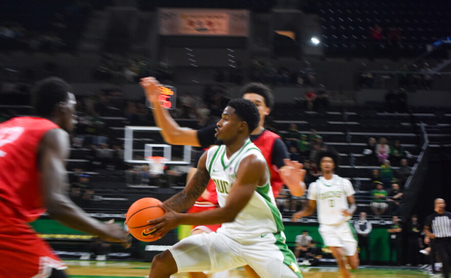 Oregon guard Fred Payne pushes past Seattle U defenders in an exhibition match on Oct. 15, 2026. Oregon lost the game 65-71.