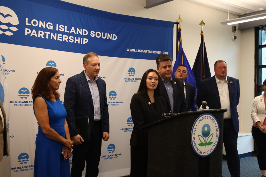 Nicole Tachiki speaks at the Port Jefferson conference along with Lee Zeldin, administrator of the U.S. Environmental Protection Agency, and Adrienne Esposito, executive director of Citizens Campaign for the Environment. Rep. Nick LaLota (R-Amityville), to Tachiki’s immediate left, also addressed the conference.