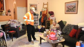Steven Olguin (left) talks with Lori Kratzer (right) on how to move the furniture to make room for her new flooring on Nov. 21, 2025, in Arvada, Colo.