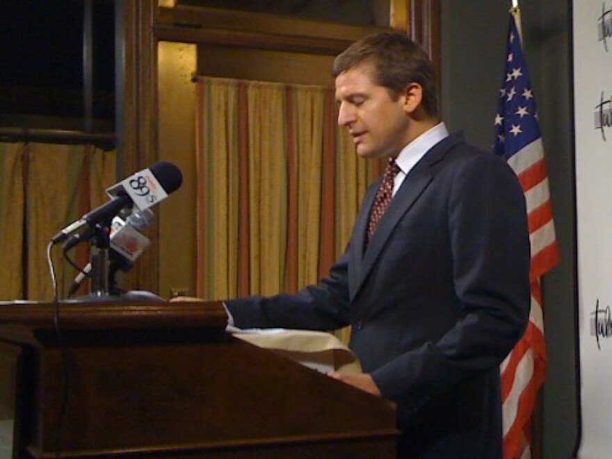 Mark Perkins addresses reporters at the Tulsa Press Club.