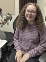 Natalie Harris at the mic in NPR Illinois Studio F.