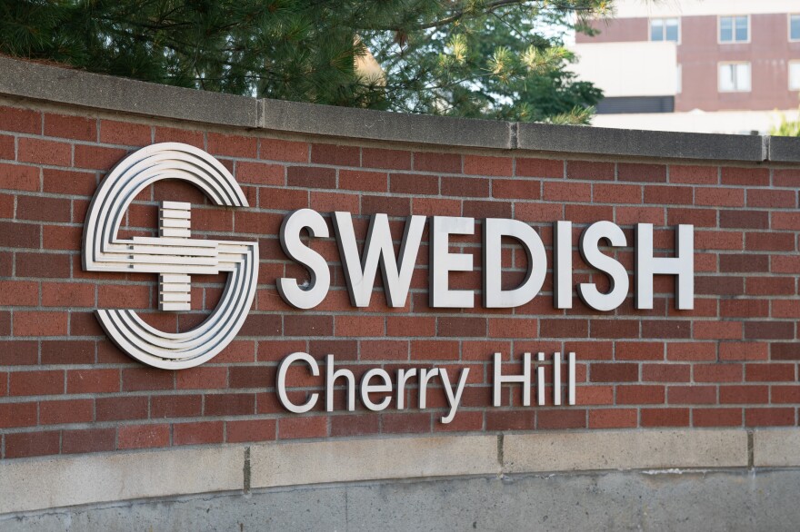 A brick wall with a sign for Providence Swedish Cherry Hill.
