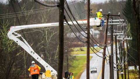 FILE: An Eversource crew on Route 44 in Bolton, Ct. repairs damaged power lines, December 18, 2023, as strong winds and heavy rain across Connecticut left more that 75,000 people without power, closed schools and snarled traffic.