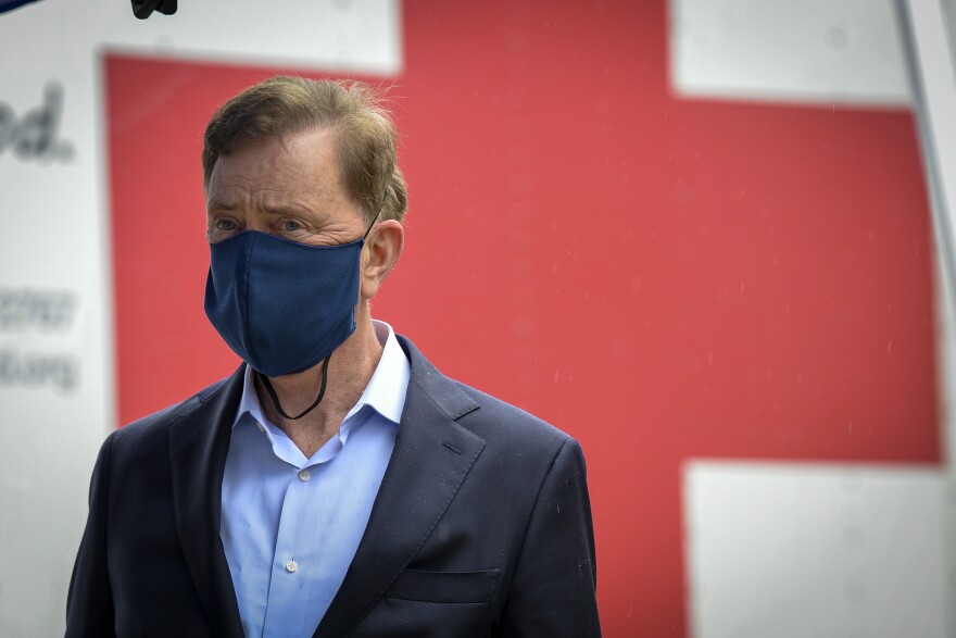 Connecticut Gov. Ned Lamont listens as Sen. Richard Blumenthal (off camera) speaks at a press conference at a Red Cross blood drive at the Connecticut Police Academy in Meriden. Blumenthal and Lt. Gov. Susan Bysiewicz joined Lamont at the event. The purpose of their visit was to encourage residents who are healthy to donate blood.