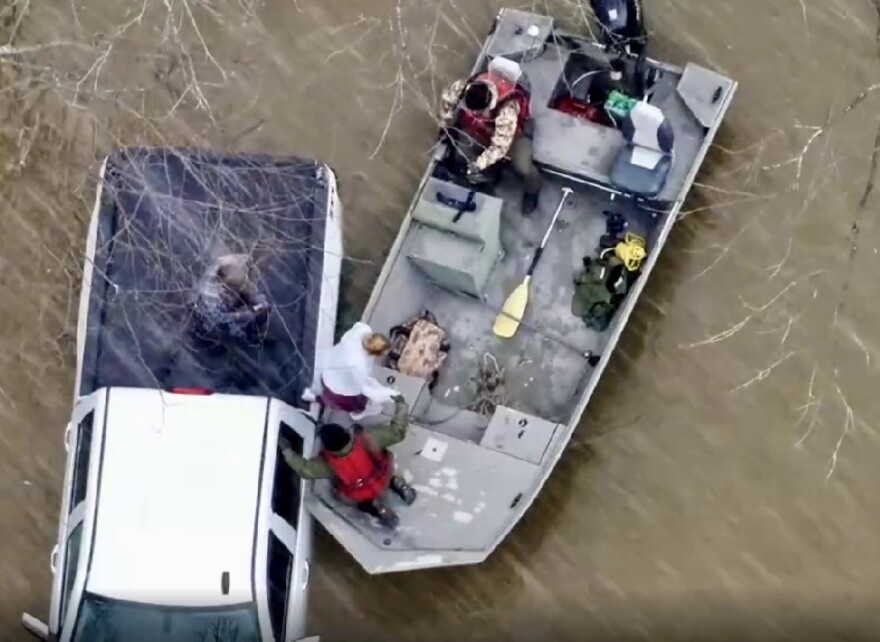 Officers rescue the two occupants of a pickup truck in Pike County floodwater March 16, 2026