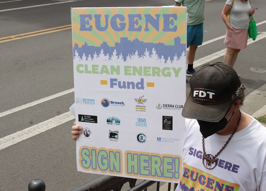 Eugene Clean Energy Fund supporters march through downtown Eugene, July 21, 2026.