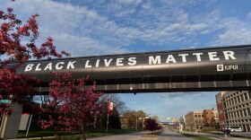 A banner displaying the message "Black Lives Matter" is pictured on a walkway over Michigan Street at IUPUI's campus on April 21, 2022.