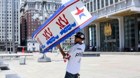 Bernie Sanders supporter and organizer Billy Taylor held a coffin painted with donkeys during a march Sunday in Philadelphia. He told NPR he applied for protest permits to "stop any Hillary supporters from obtaining permits."