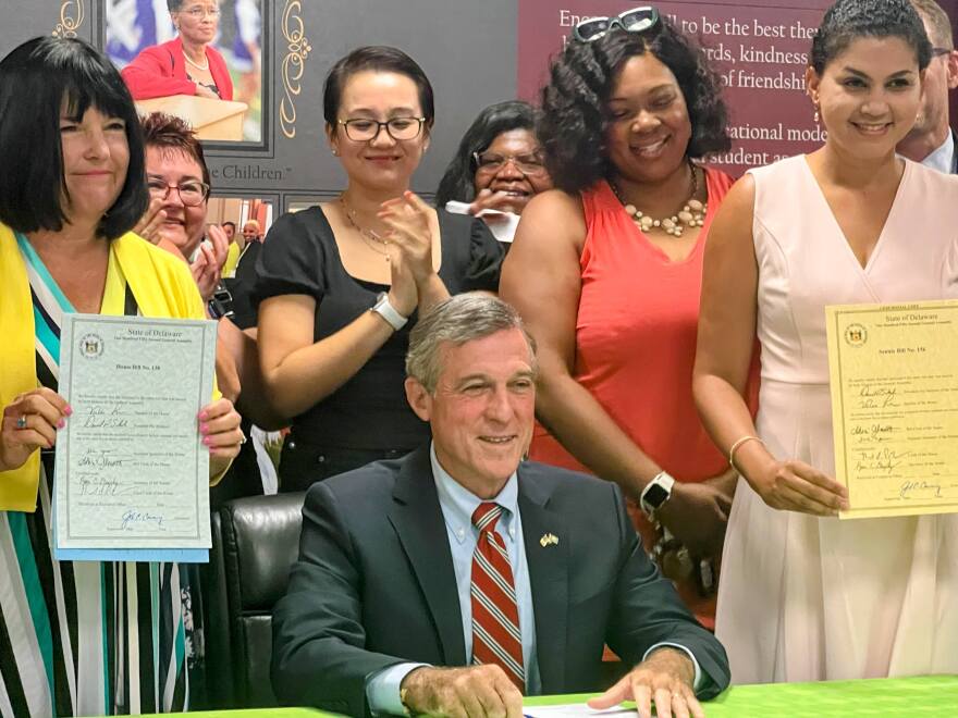Governor John Carney signs two bills that aim to bolster the teacher workforce.