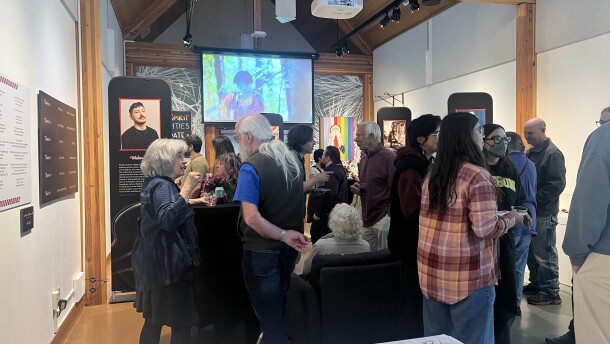 People standing around an exhibit