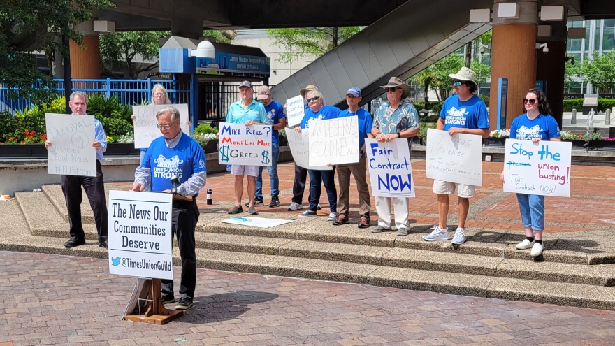  Florida Times-Union employees publicize their contract negotiations on April 7, 2023, at James Weldon Johnson Park in Jacksonville.