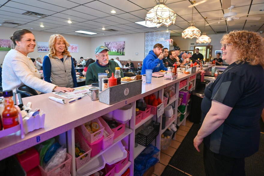 Tammy Stochla, owner of Tammy's Kitchen in Luzerne, talks with state Sen. Lisa Baker and Republican gubernatorial candidate Stacy Garrity.