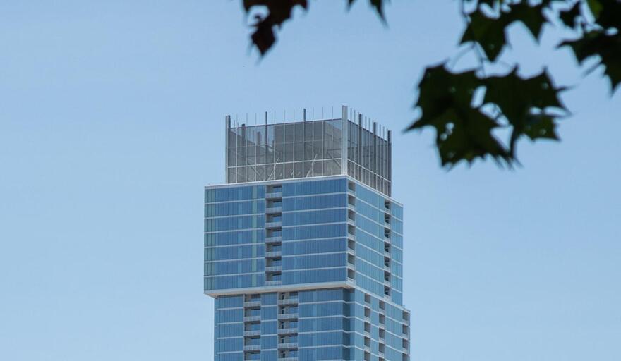 The top of the Independent in downtown Austin, as seen during the day.