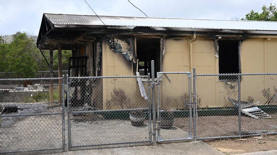 Pictured: Fire investigators are working to determine the cause of a fire that destroyed the Williams Delight home of slain Executive Security Officer Eustace Charles late Thursday night.